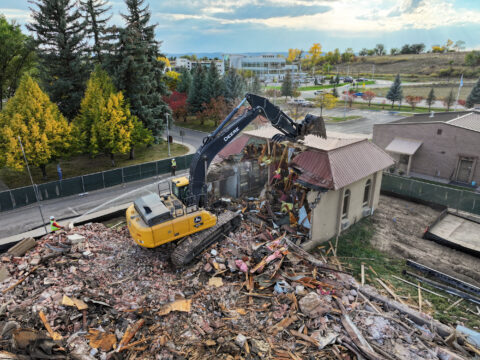 The remaining structure of the Ute Vocational School-Head Start building is seen being taken down on Tuesday, Oct. 15. In the distance, the Southern Ute Growth Fund Building can be seen as a stark contrast of the past and future.